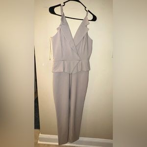 Khaki colored jumpsuit, can be worn professionally or out to a club.
